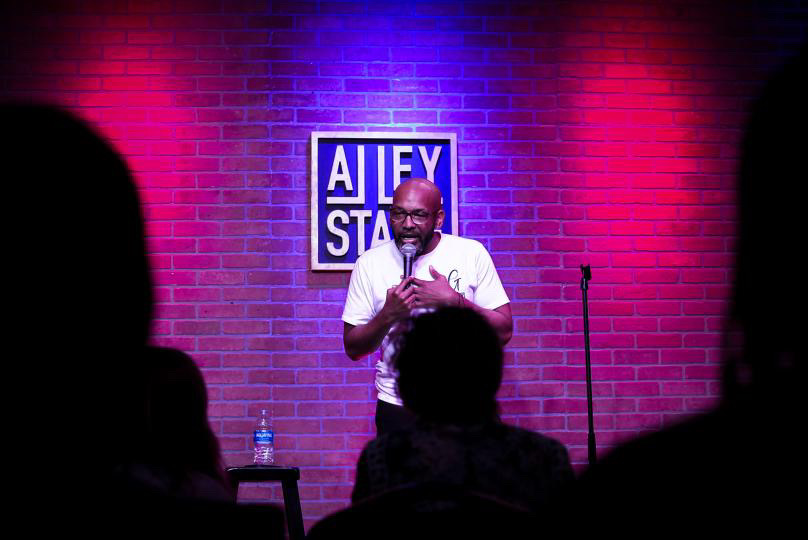 Plug Chapman performing stand-up comedy