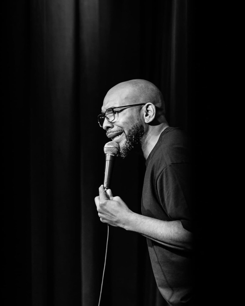 Plug Chapman performing stand-up comedy