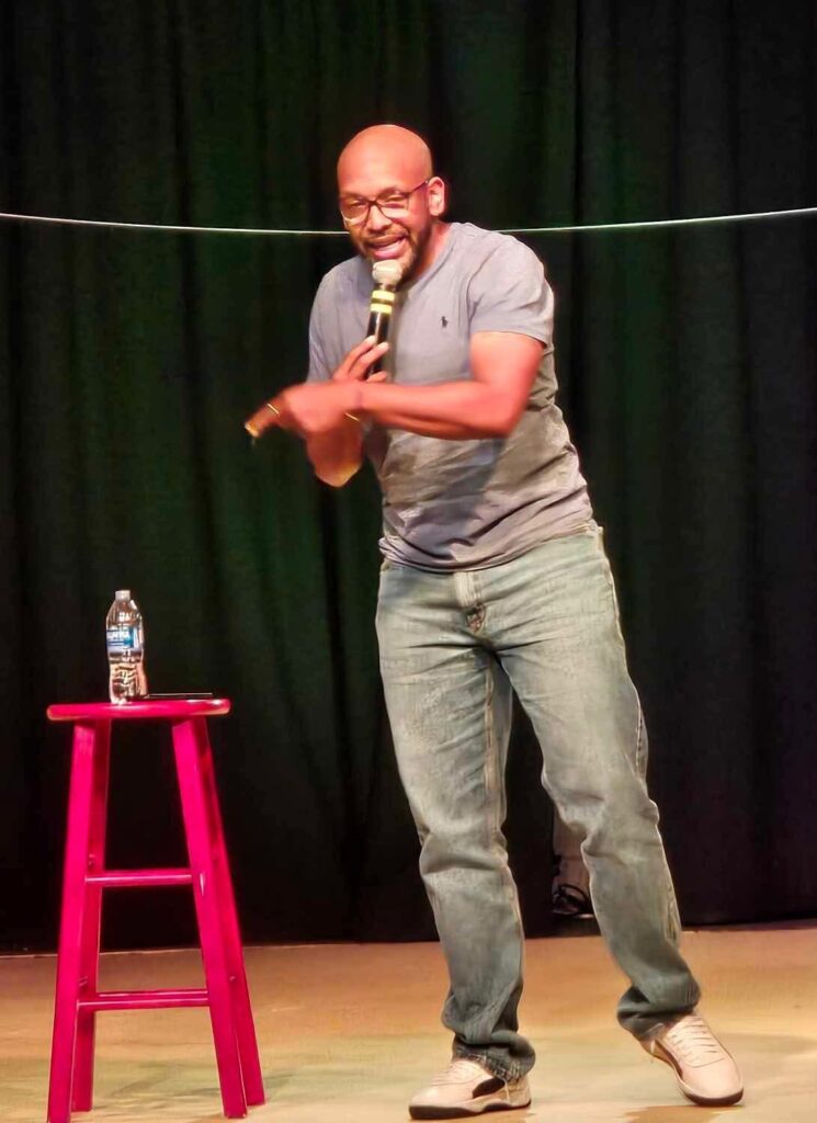 Plug Chapman performing stand-up comedy